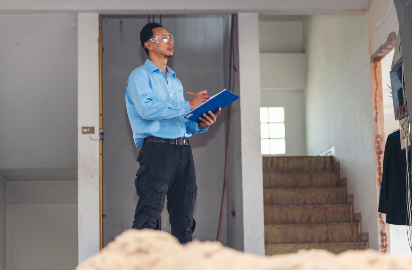Home inspector examining a property during the inspection contingency period of the home buying process